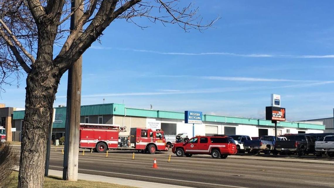 Boise Fire Departmen trucks block a portion of the northbound lanes of South Cole Road on Friday afternoon while fighting a fire inside Western Records Destruction.