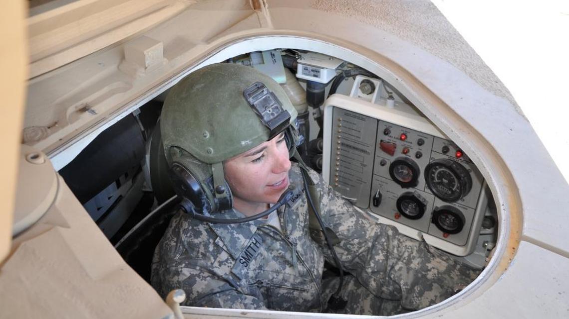 Sgt. 1st Class Erin Smith of the Idaho Army National Guard maneuvers an Abrams M1A2 tank at the Orchard Combat Training Center south of Boise.