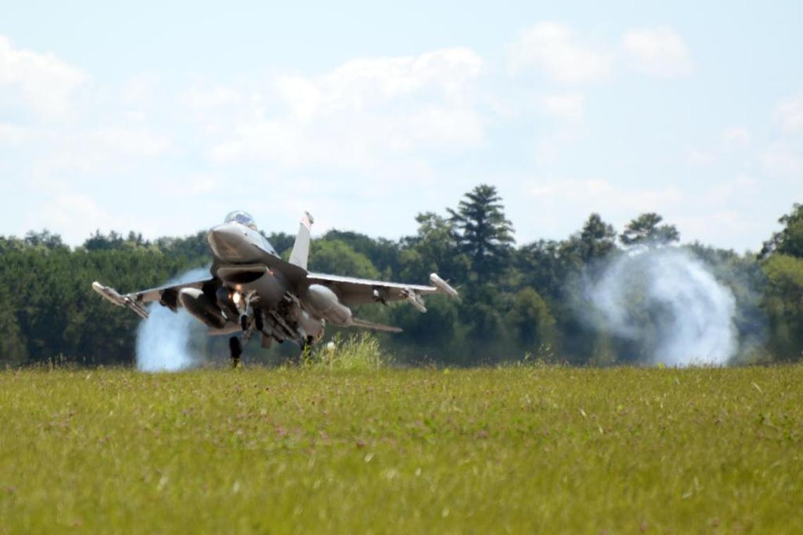 An F-16 Fighting Falcon from the 115th Fighter Wing in Madison, Wisconsin, lands on the runway at Volk Field Air National Guard Base on July 16, 2014. 