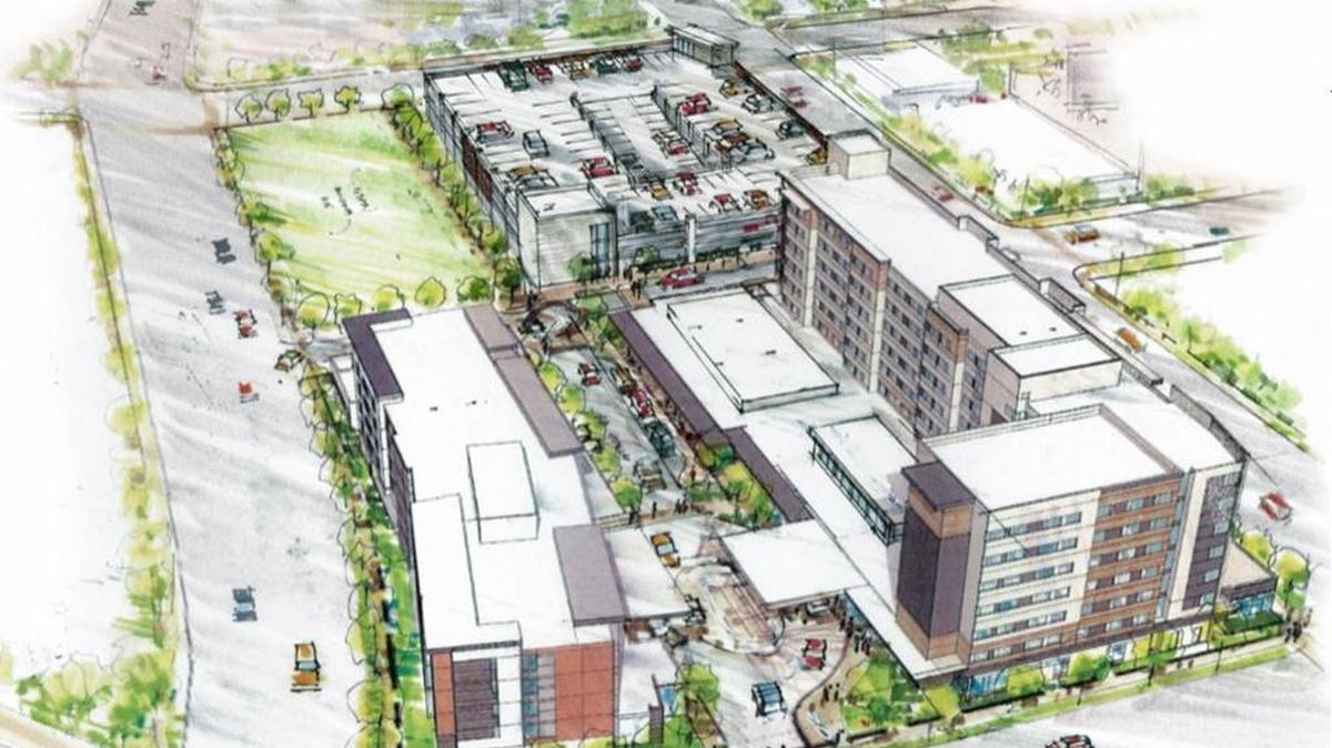 This rendering shows Gardner Co.’s two-hotel proposal on Parcel B viewed from the southeast, with 11th Street in the foreground. The larger hotel, right, will be a Hilton Embassy Suites, and the smaller hotel, left, will be a different Hilton offering, Gardner says. The developer no longer plans to build condominiums on top of the parking garage, top.