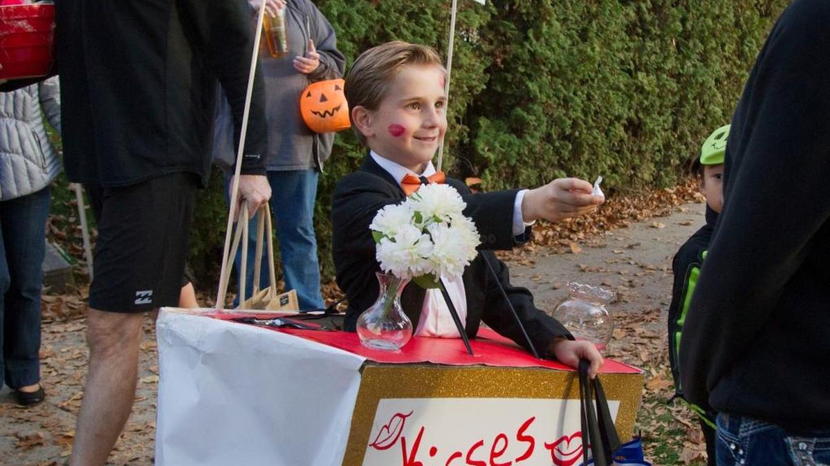 “I like to dress up,” says Ethan Bergener, 8, dressed as a kissing booth. Ethan played to the crowd as well, passing out chocolate kisses to Harrison homeowners as well as surprised parents. “Someone actually kissed me,” he said. “Embarrassing.”