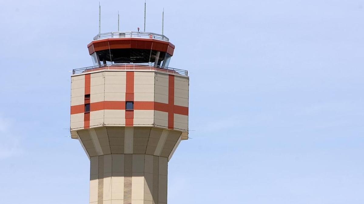 Air traffic controllers monitor planes from inside the Boise Airport tower.
