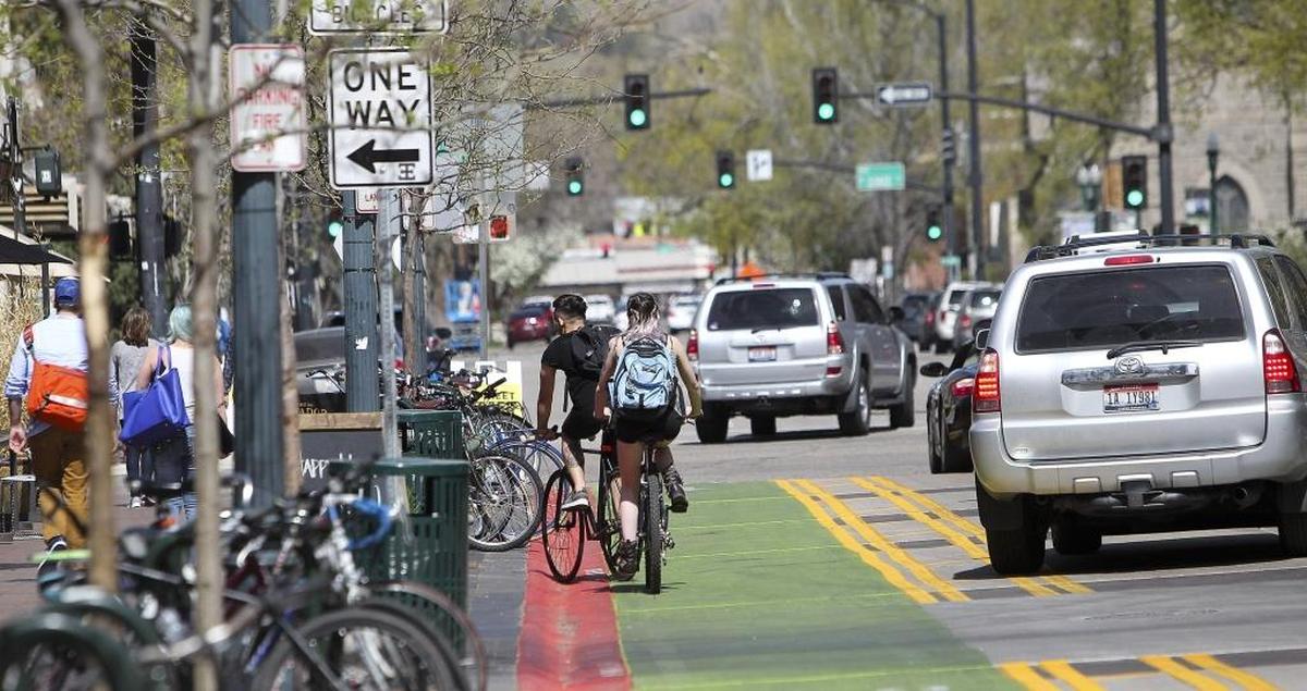 Bikers and cars make their way up N. 8th Street in downtown Boise, Idaho. Since January, everyone who has taken the state test to get a driver’s license has had to answer at least one question about bicycles and pedestrians. Friday April 8, 2016