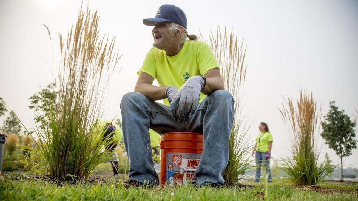 David Williams picks weeds as part of landscape work at Esther Simplot Park on Sept. 5. Williams is part of a group of workers who were once homeless and found jobs with Boise Parks and Recreation through a program co-hosted by Interfaith Sanctuary. The J.A. and Kathryn Albertson Family Foundation is donating money to the city to keep the program going through the winter and expand it next year.