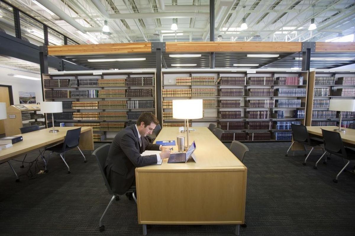 A student studies in the library of the Concordia University College of Law om Boise.