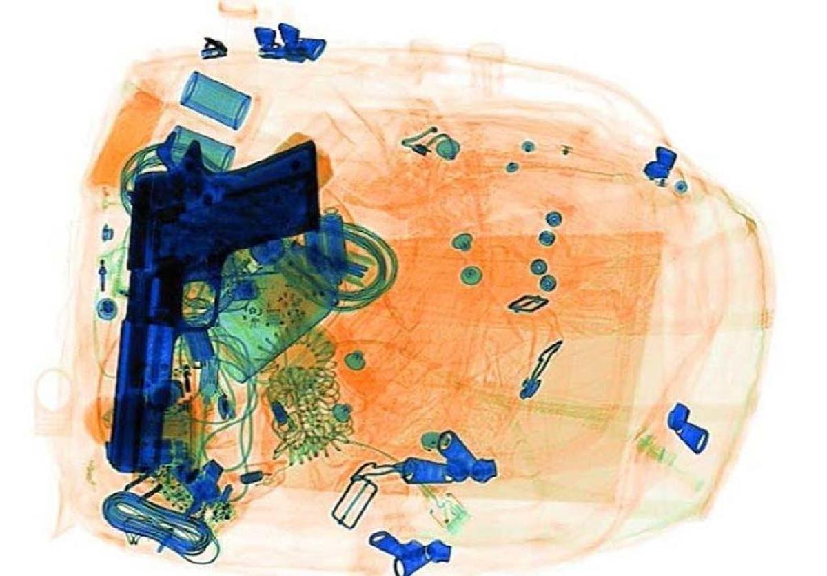 This image, declassified by the TSA, shows what a handgun concealed in a backpack looks like through an X-ray machine at a security checkpoint. The image is not from one of the incidents at the Boise Airport.