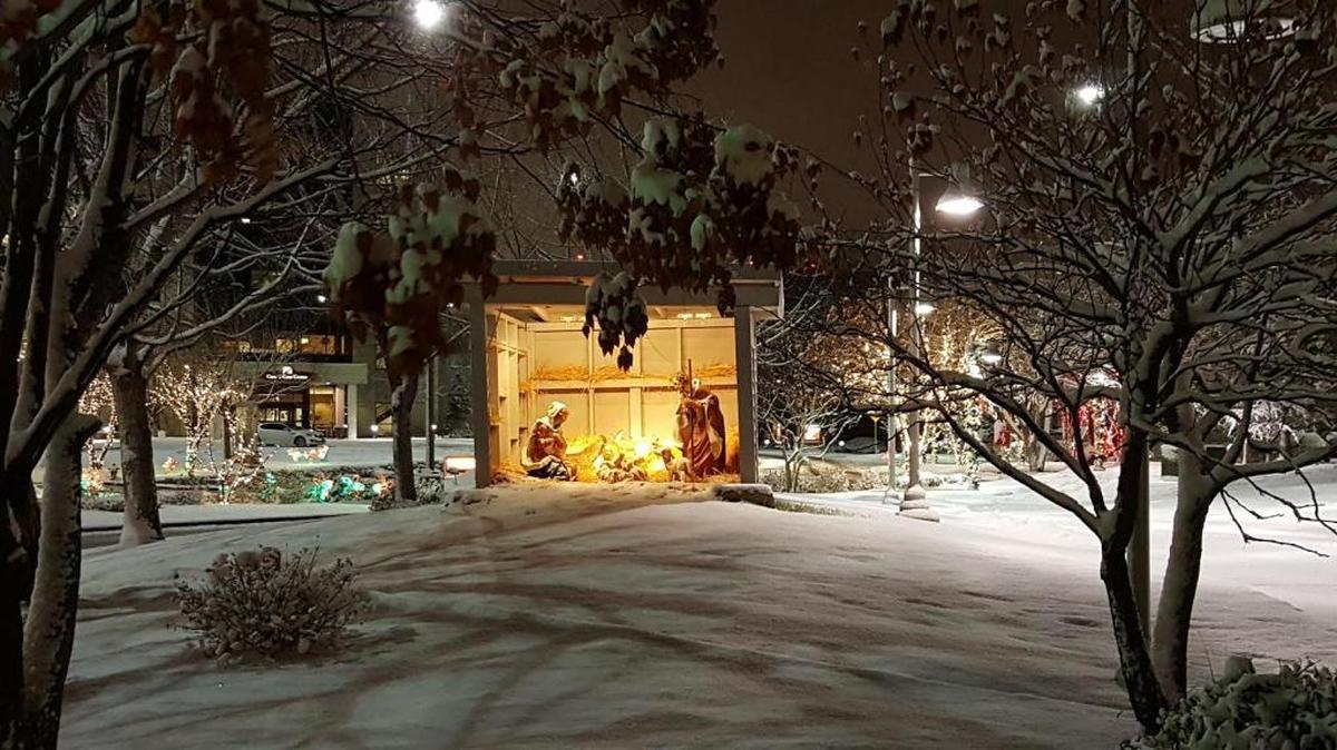 Wednesday’s snowfall provides a wintry setting for the nativity scene in front of Saint Alphonsus Regional Medical Center in Boise.