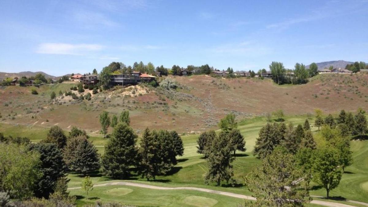 A view of the east end of the Crane Creek Golf Course, looking north toward the end of Chardie Road and a cluster of homes around Chardie Court, which ends in a cul-de-sac. Developers Chris Conner and Dave Yorgason plan to build 57 homes on 54 acres wrapping around this part of the golf course. Their subdivision would include homes on an extended Chardie Road east of Chardie Court and more homes on the east and south sides of the golf course.