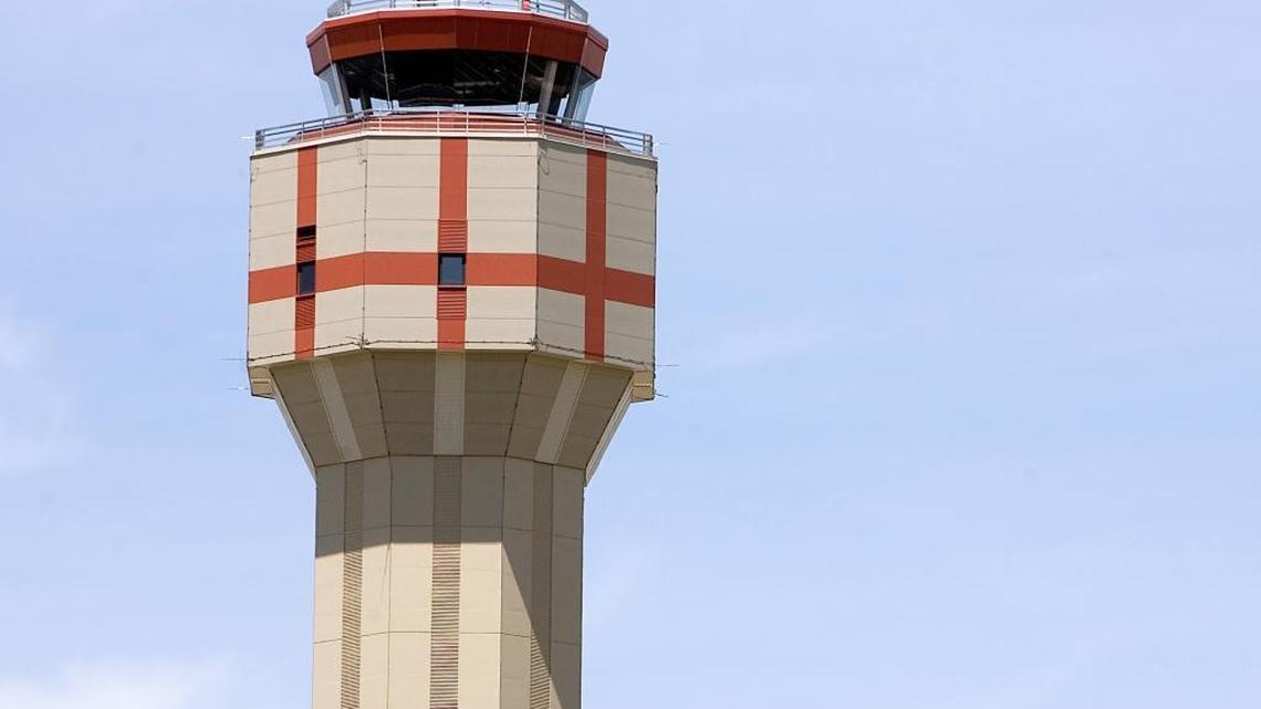 Air traffic controllers monitor planes from inside the Boise Airport tower.