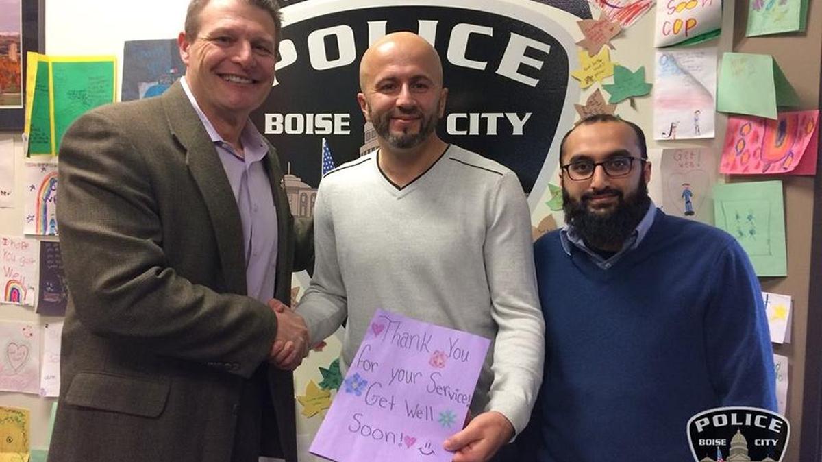 Boise Police Chief Bill Bones thanks representatives of the Islamic Center of Boise who dropped off a card and donation Monday.