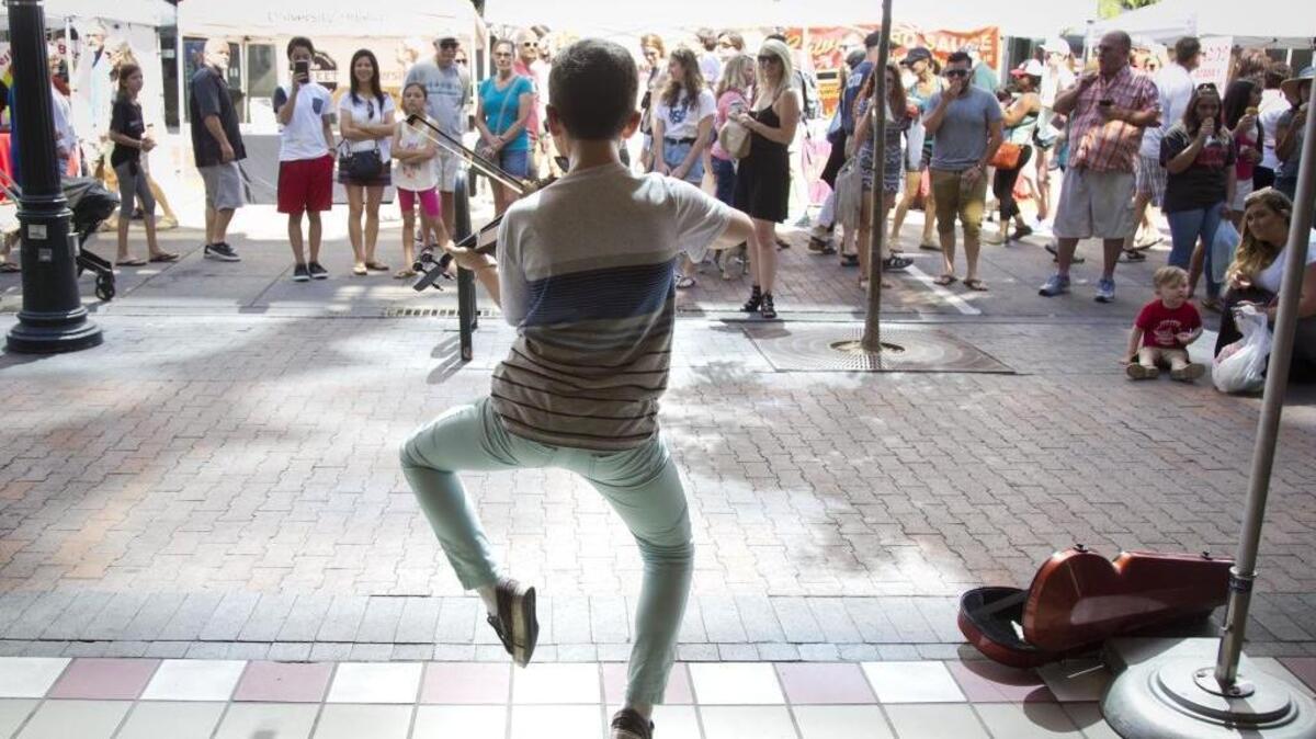 Josh Emara, 12, performed for tips at Capital City Public Market on most Saturdays in 2017. Katherine Jones, Idaho Press Club photographer of the year, also won an award for her images of Josh.