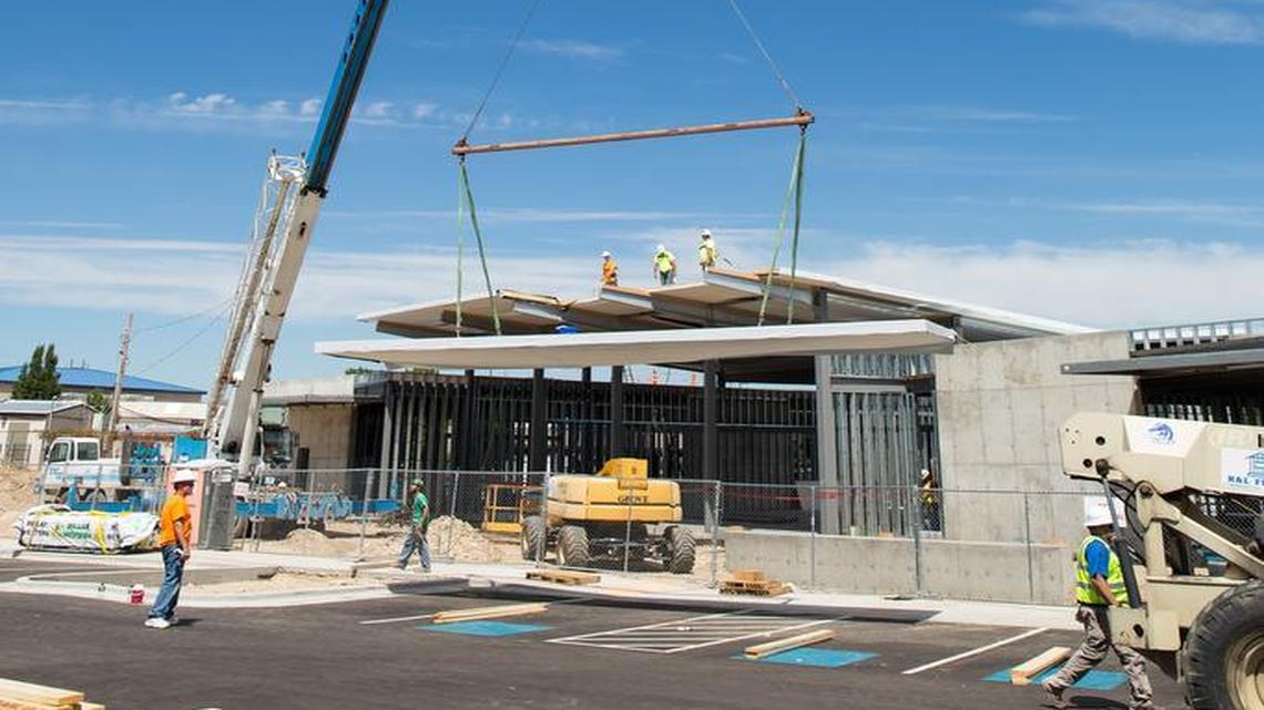 Workers prepare the roof of Boise’s new Bown Crossing library branch Aug. 10.