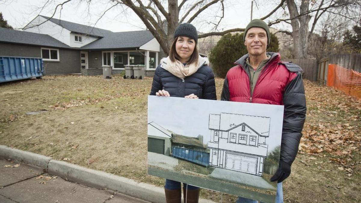 Mark Utting, representing the East End Neighborhood Association, and Brittney Scigliano, a neighbor, have mobilized their neighborhood to start a conservation district in response a proposal for what they consider a clashing home style on a vacant lot on Mobley Drive behind them.