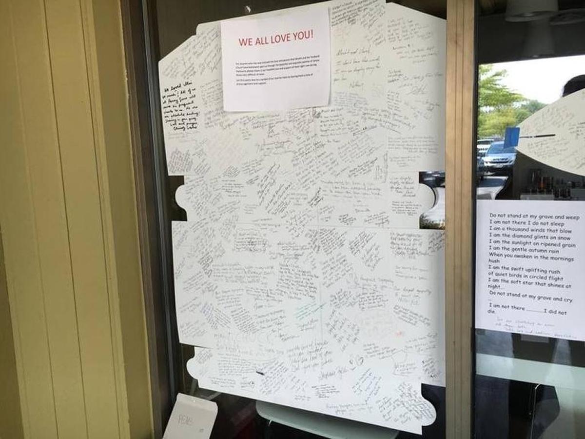 Several large cards, made of pastry boxes, with messages of support were affixed to the front windows of Janjou Patisserie in August 2016, after the drowning death of the owners’ son.
