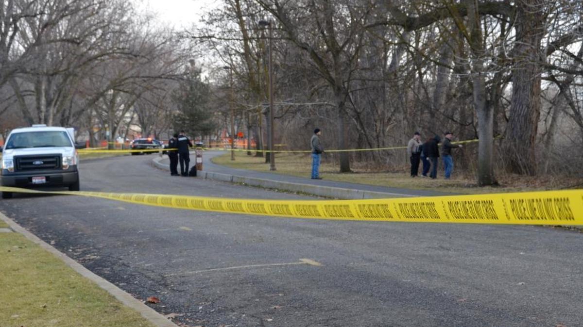 Boise police investigate the scene in Julia Davis Park Saturday where a man, possibly in his 50s, was found dead.