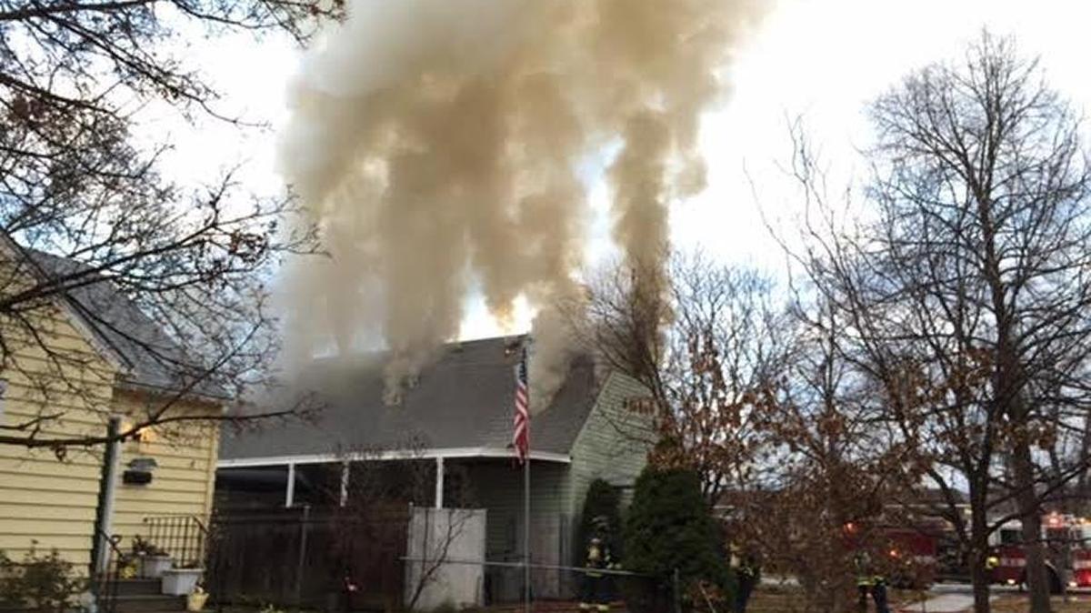 Smoke vents from the attic of a home in the 400 block of Jefferson Wednesday.