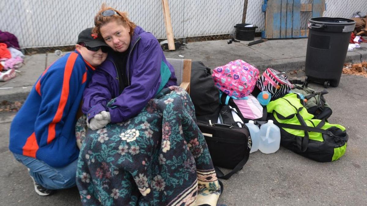 Anita and Meaghan Sletto pause while packing up belongings during the Cooper Court eviction on Dec. 4. After the disbanding of the homeless encampment the Slettos wandered around Idaho and Boise, sleeping in stairwells, friends' homes and in portable restrooms. Anita died Tuesday morning.