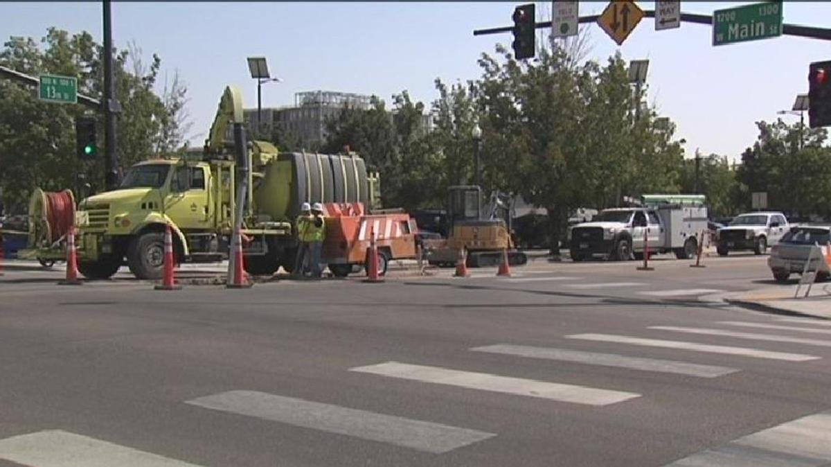 Crews work to repair a geothermal line at Main and 13th streets in Downtown Boise Monday afternoon.