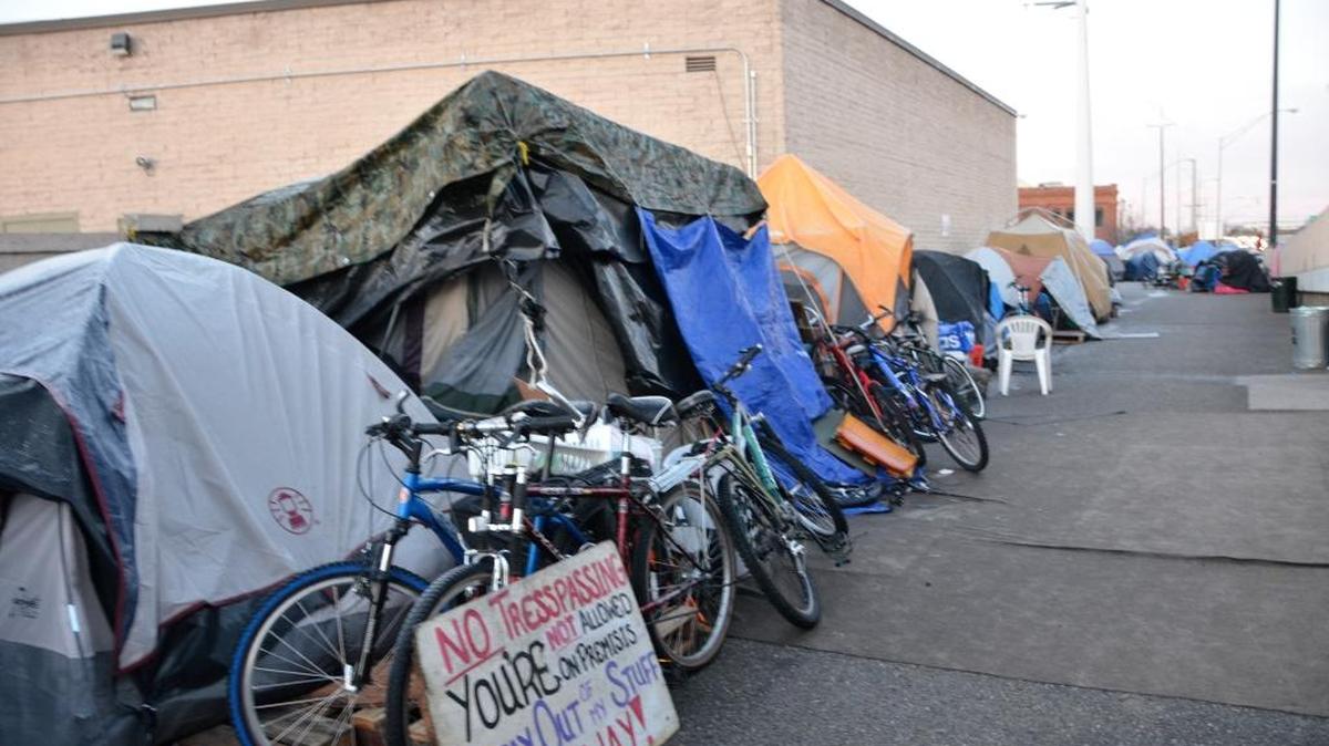 City officials put up a fence in the Cooper Court area to curb the growing encampment.