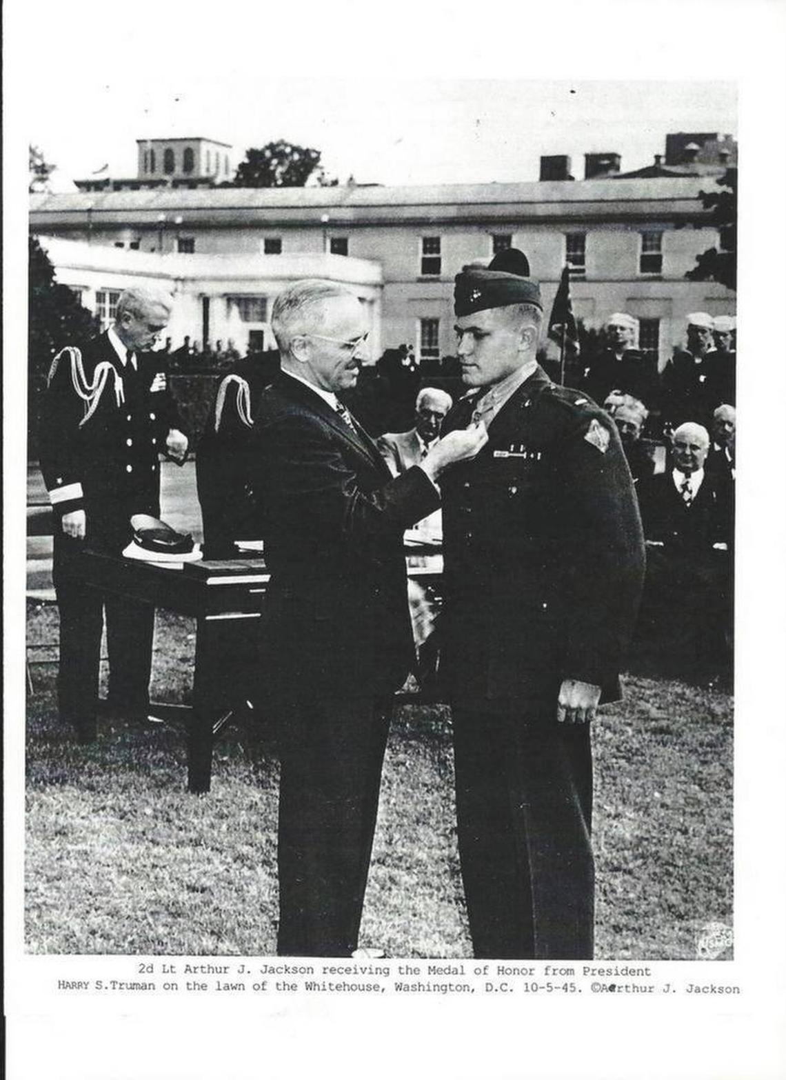 President Harry S Truman pins the Medal of Honor on Art Jackson during an Oct. 5, 1945, ceremony on the lawn outside the White House.