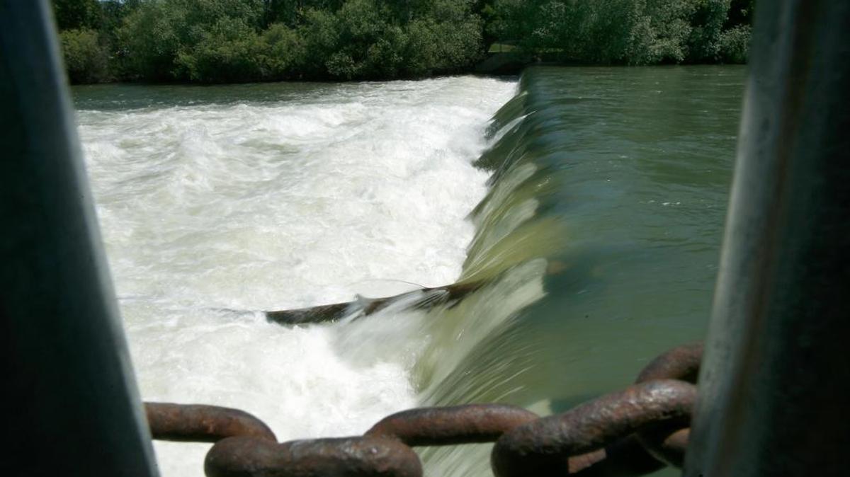 File: Water flows near the Americana Bridge in 2010.