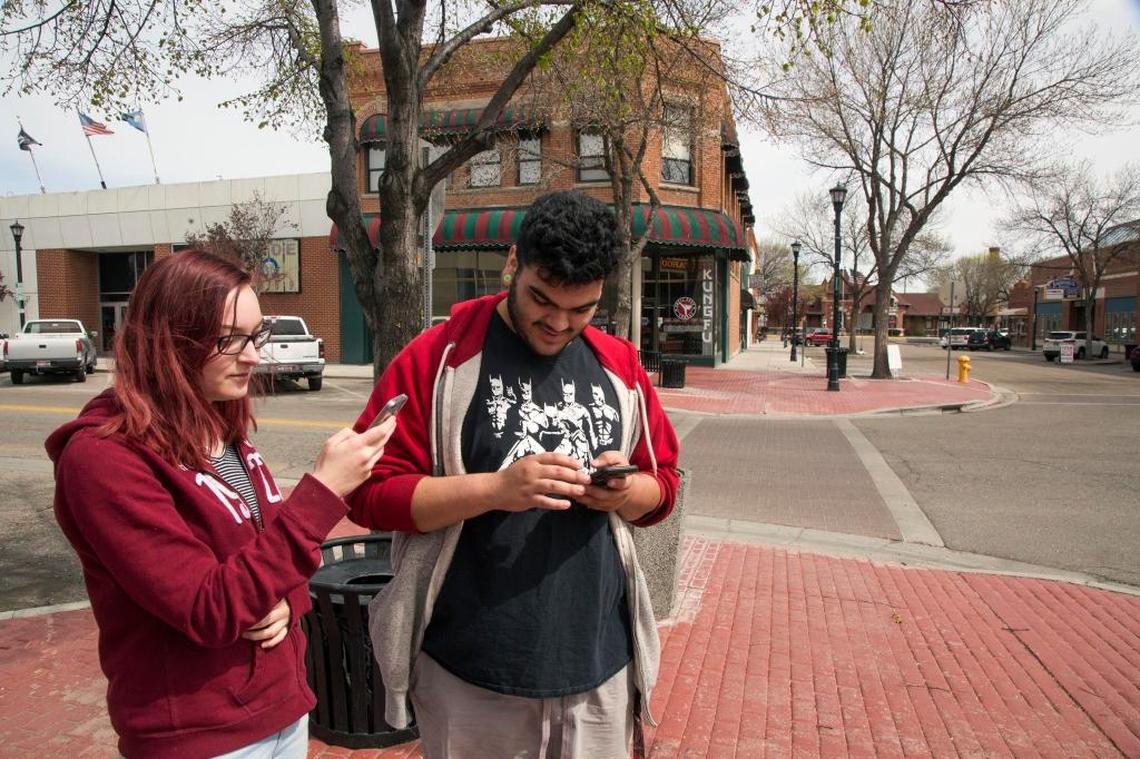 Ella Kidd, left, and Izayus Davila, both of Nampa, spend their lunch hour Thursday in downtown Nampa hunting Pokemon creatures on their phones. Mayor Debbie Kling hopes more businesses will be interested in occupying Downtown storefronts once disruptive construction work is done.