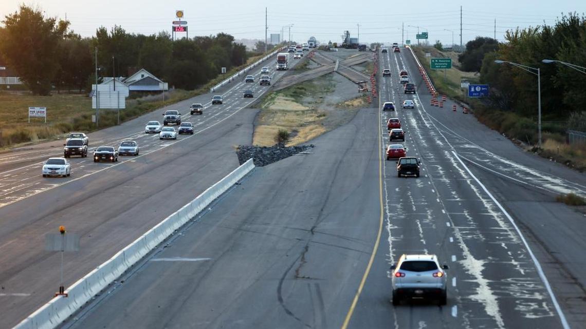 The Interstate 84 overpass at Franklin Boulevard in Nampa, Exit 36, looking west. The wider, resurfaced I-84 lanes abruptly stop at the Franklin overpass and narrow to two cracked, rutted lanes.