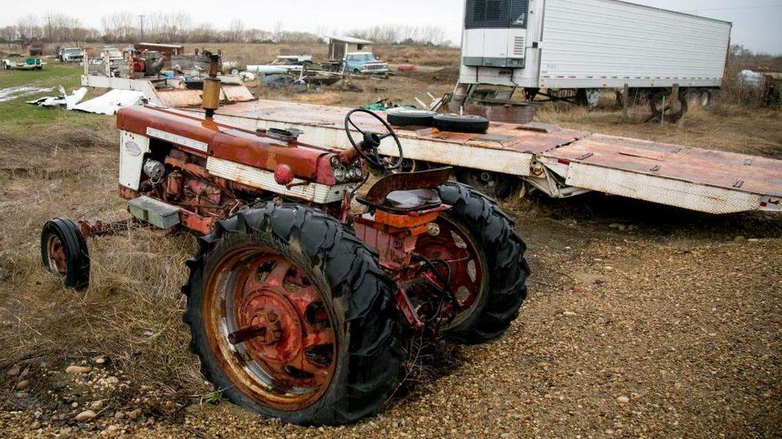 A tractor, semitrailer and several vehicles littered the property of John McEvoy in March.