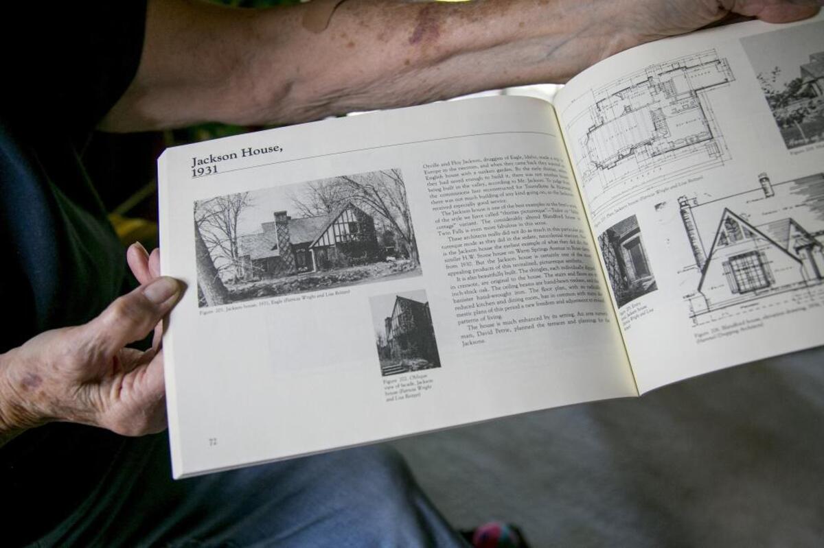 Shari Sharp shows off a book of Tourtellotte and Hummel designs featuring her home. The architects behind the Idaho Statehouse designed a few homes over the years, but none other in the Tudoresque style of the Jackson House. They were able to take the project on because of a lull in their business created by the Great Depression. The home was finished in 1931 and cost $7,500.