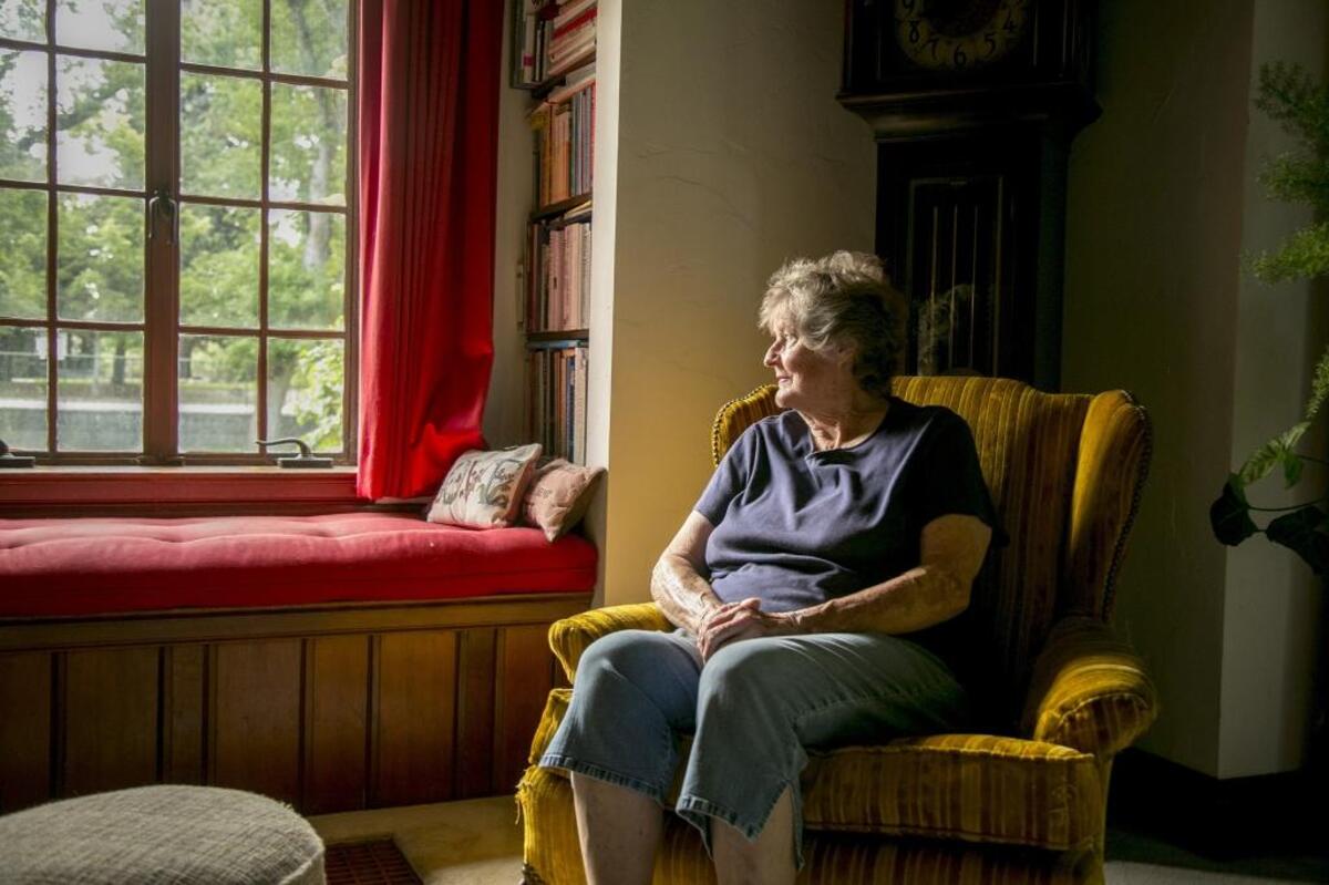 Shari Sharp is pictured in the living room of the home her parents built in 2017. Sharp, 80 when this photograph was taken, spent many years hoping the city would buy the property and preserve it. City officials disagreed over purchase, and plans fizzled over the course of years. In 2021, the city, helmed by Mayor Jason Pierce, took the plunge and bought the property.