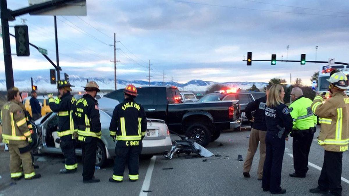 Four people were removed from the wreckage of a two-vehicle crash on Idaho 44 and Park Lane on Monday morning.