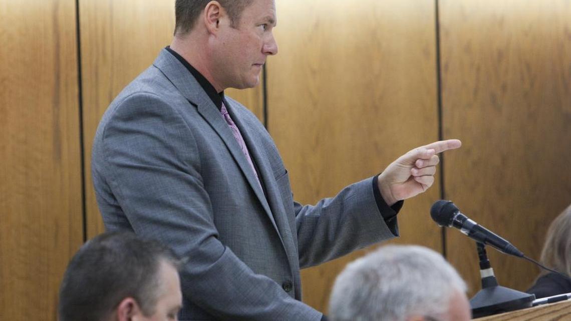 John Bujak serves as his own attorney during a 2012 trial, cross-examining witnesses on a charge of misusing public funds. This was one of four trials in which Bujak was charged with felonies but not found guilty.