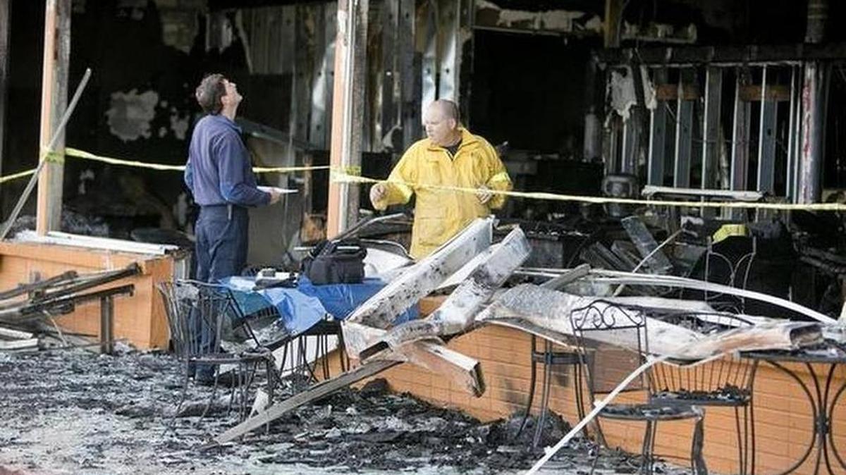 Fire investigators look over the inside of the Boise International Market, which was destroyed in a 2 alarm fire Sept. 19. Nearly 20 vendors were displaced by the blaze.