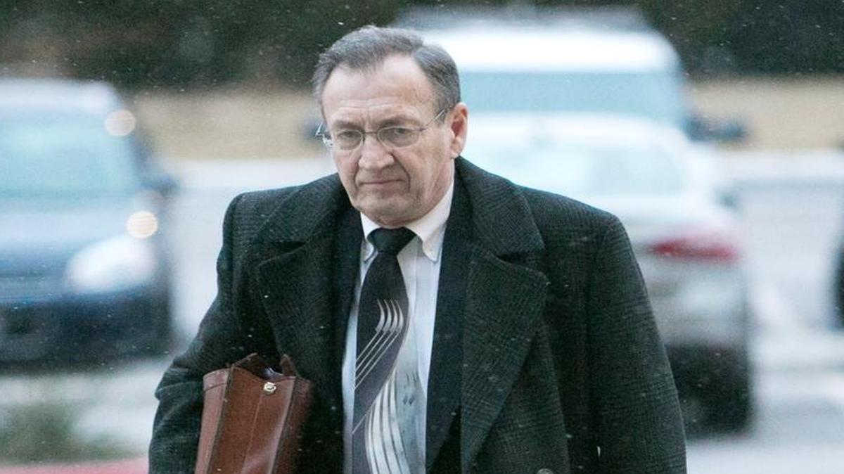 Mark A. Ellison, a DBSI co-founder and later the company attorney, makes his way into federal court in Boise in February 2014, during his trial.
