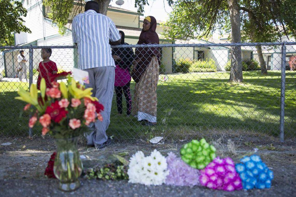 Ibod Hasn, center, talks to a friend who came to visit after the stabbing attack on Wylie Lane in Boise on Saturday night. Hasn is a refugee from Somalia, and she said seeing the blood reminded her of Somalia.