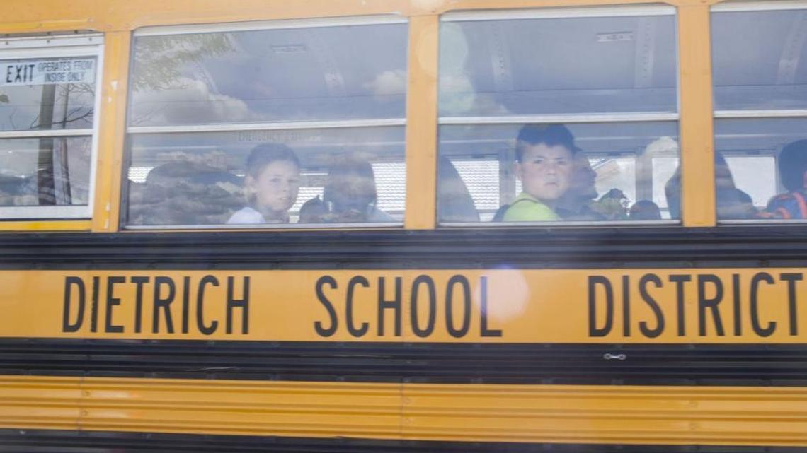 School buses arrive at the Church of Jesus Christ of Latter-day Saints on Wednesday, May 25, in Dietrich. Dietrich School was put on lockdown earlier in the day following allegations of racial and sexual abuse of a black teen by his teammates on the football team.