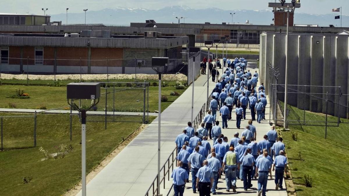 Inmates walk from a cellblock to a dining hall at the Idaho State Correctional Institution near Boise in 2010.