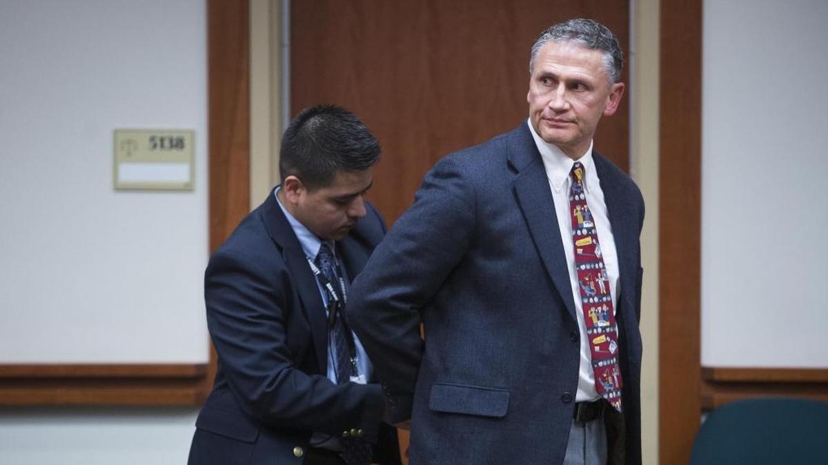 A bailiff handcuffs Mountain Home dentist John Goodrich after Goodrich was sentenced Friday for one felony count of distributing a controlled substance. Judge Michael Reardon said he wanted Goodrich’s sentence to serve as a deterrent to others in the medical profession.