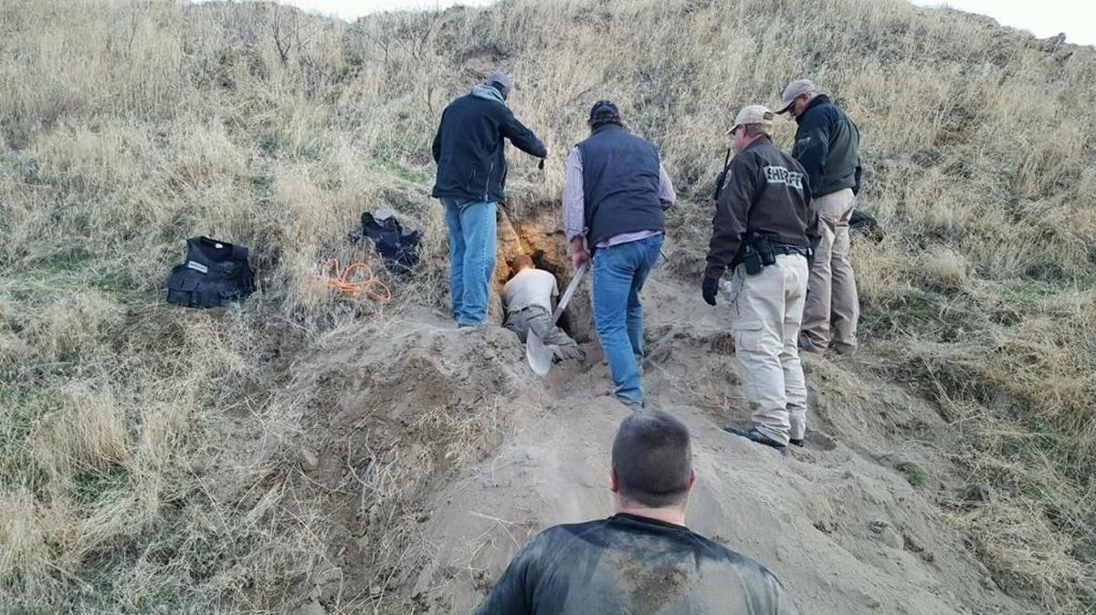 Police dig out a fleeing suspect, Gregory A. Morrow, after he got stuck 8 feet underground in a badger hole in Eastern Oregon on Nov. 3.