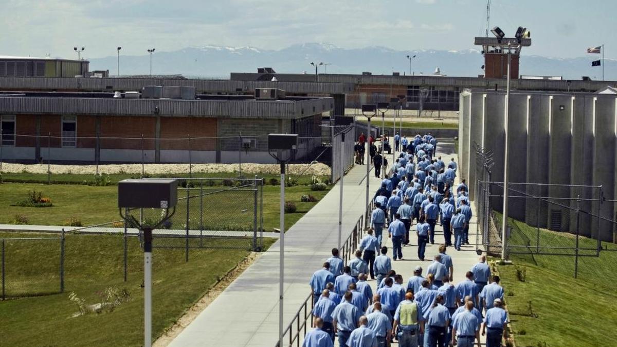 Inmates walk to the dining hall from their cell block at the Idaho State Correctional Institution outside Boise in this 2010 photo.