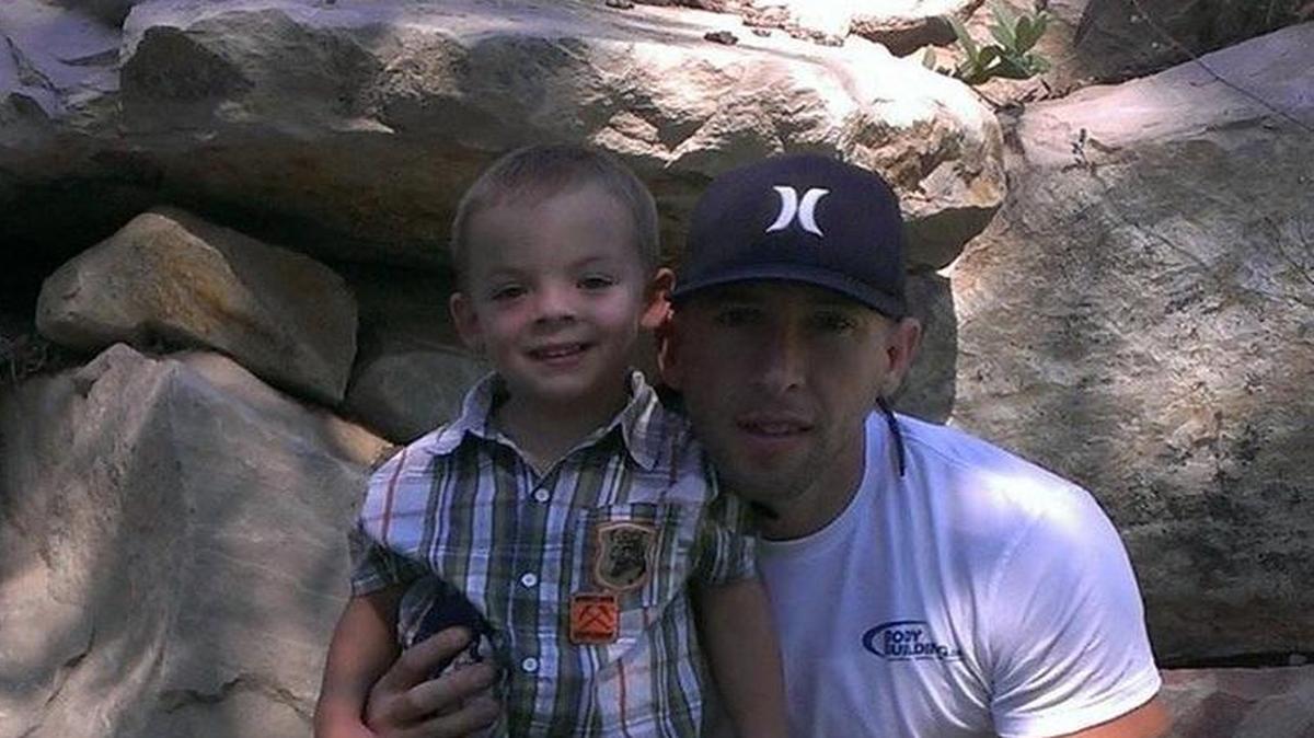 Matthew Conrad poses with his son, Elijah, now 5, during a July 2015 visit to Park City, Utah, where Conrad’s sister, Megan Thomas, resides.