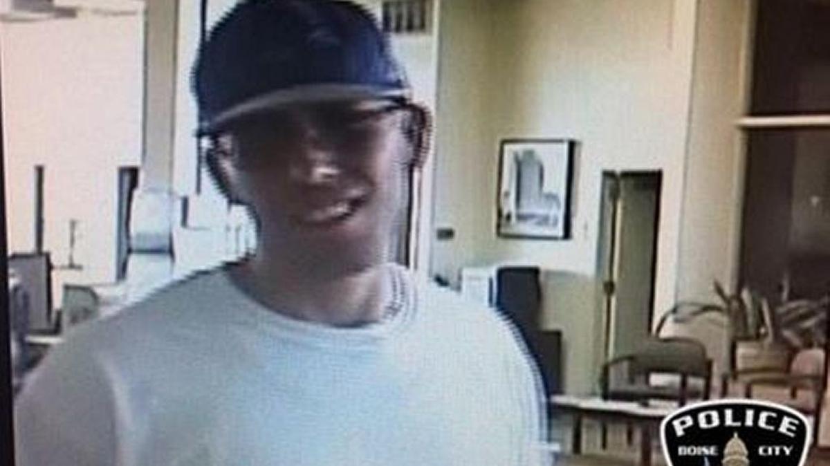 This man, shown in a bank surveillance photo, is suspected of robbing a bank on Fairview Avenue Friday evening.