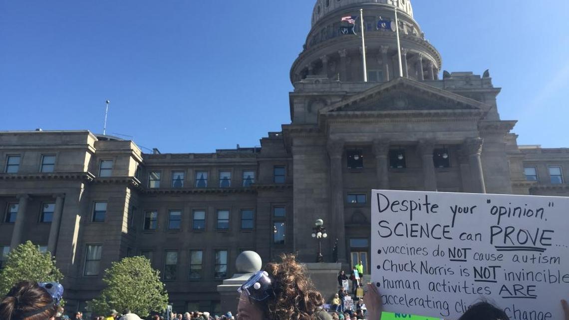 Molly Wolk, middle, with goggles, is a science teacher who says she hopes scientific literacy can benefit all of her students at the College of Western Idaho. Wolk was one of about 1,000 people who marched at the Idaho statehouse on Saturday as part of the March for Science.