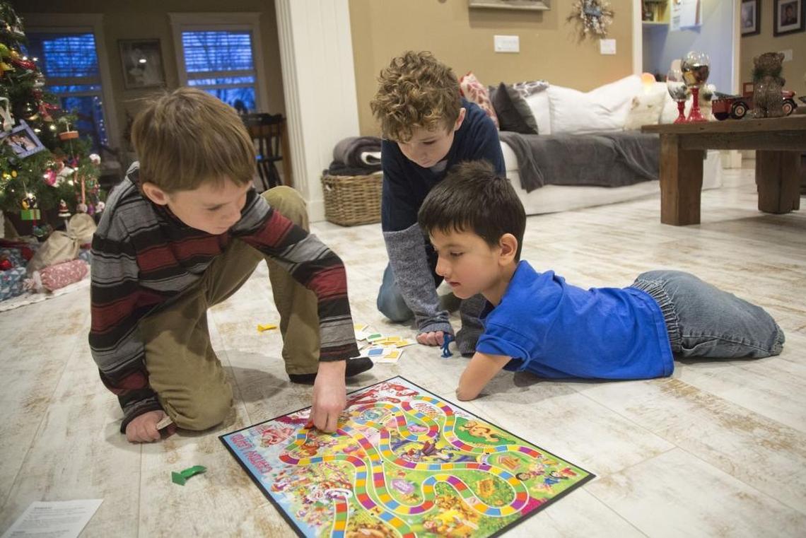 The Toomey brothers — Brooks, 9, Heath, 11, and Bowen, 9 — play a game of Candyland in the family room of their Eagle home. It’s a rare quiet moment between the siblings. “I think he’s the most mature of the three of us,” Heath says. “He’s definitely the smartest. When he wants to, he can be well-behaved and he’s very innovative and good at improvising.”