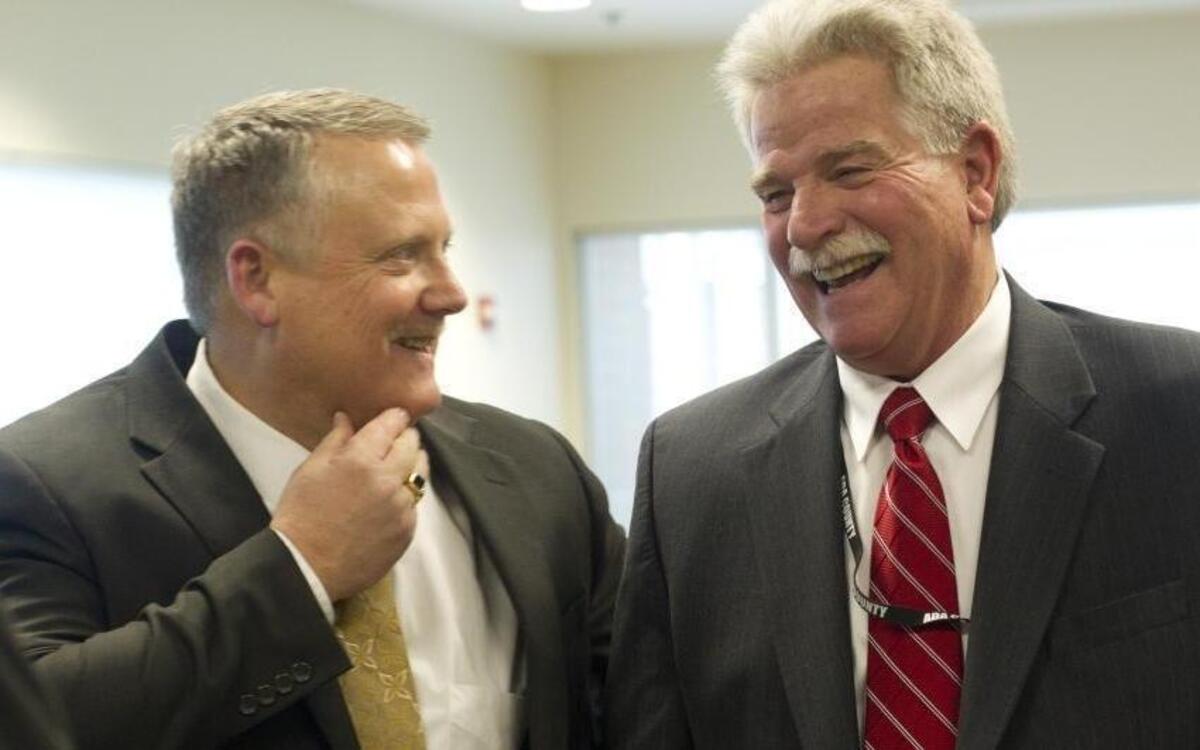 Ada County Commissioners Dave Case, left, and Jim Tibbs at their swearing-in ceremony on Jan. 14, 2013, at the Ada County Courthouse.