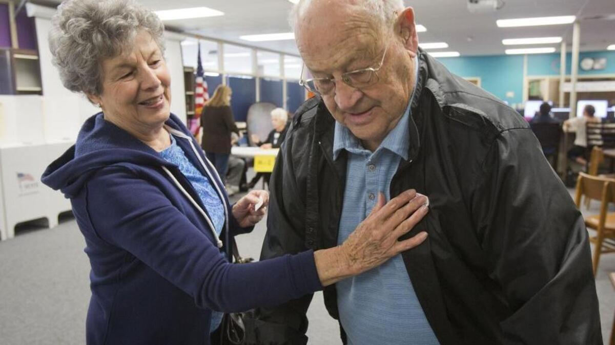 Bill and Carolyn Reese note their voting with stickers at Lowell Scott Middle School. In a school district marked by school board controversy, voters in West Ada School District went to the polls today, Nov. 3, to vote on a $14 million-a-year supplemental levy for two years.