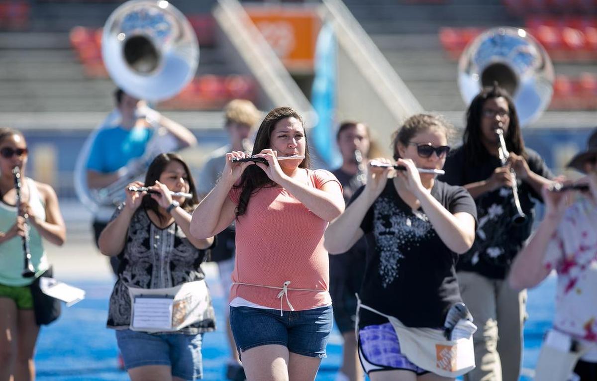 Kennia Carpinteyro, center, practices with Boise State University’s Blue Thunder Marching Band. As her debt rises to attend Boise State, she wishes school officials could do more to help with increasing costs.