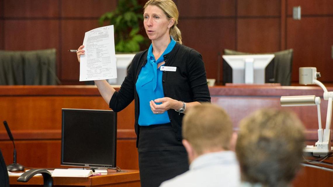 IPI Research Director Vanessa Fry presents findings on the impact of homelessness on youth at the Ada County Courthouse.