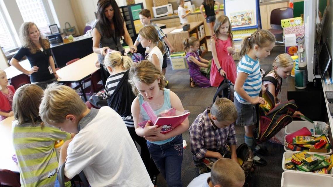 Second-graders at Roosevelt Elementary organize supplies they brought in for the first day of school in this 2012 photograph. Boise School District is considering a plan to start and end its school year earlier than it does now.