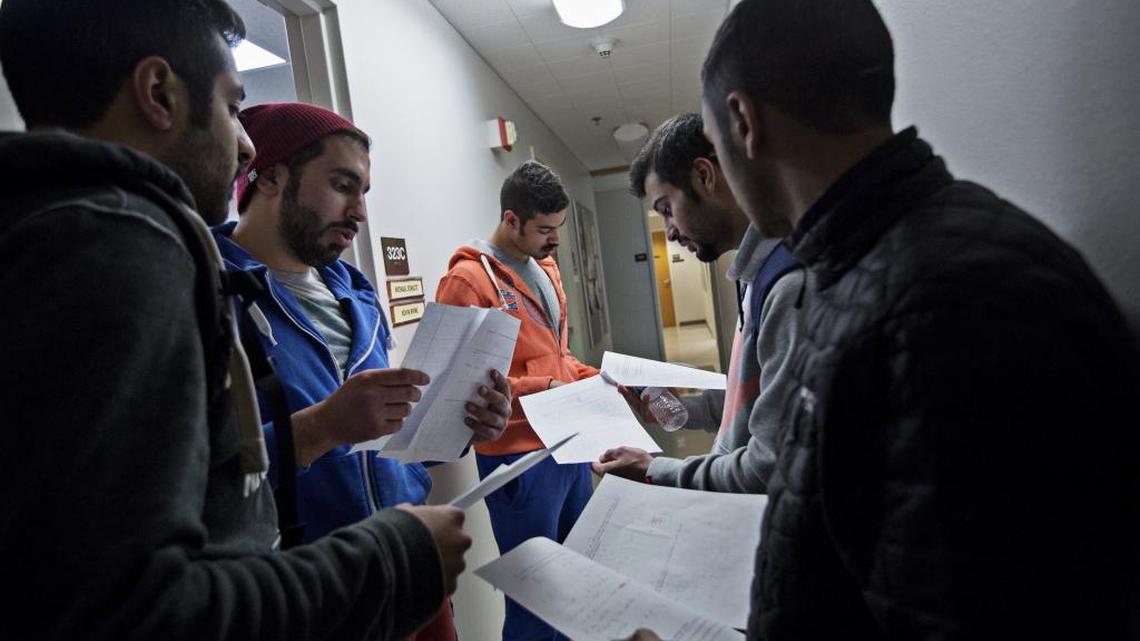 Five Kuwaiti students at Idaho State University look over the results of a math quiz last February outside their professor’s office. A growth strategy at the university has faltered amid culture clashes in Pocatello and funding cuts from Middle Eastern countries that send students there. The students, from left: Fahad Alwadhi, Omar Alkandari, Mohammad Aldaei, Omar Alfilkawi and Yousef Alhaji.